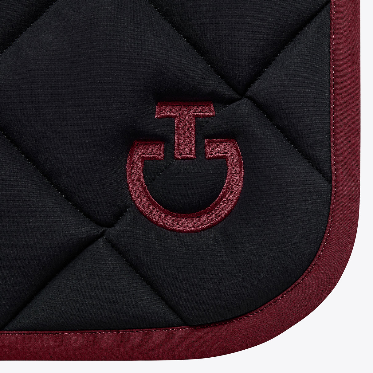 Set sottosella e cuffia Jumping Cavalleria Toscana con trapuntatura a rombi blu con logo e bordo bordeaux